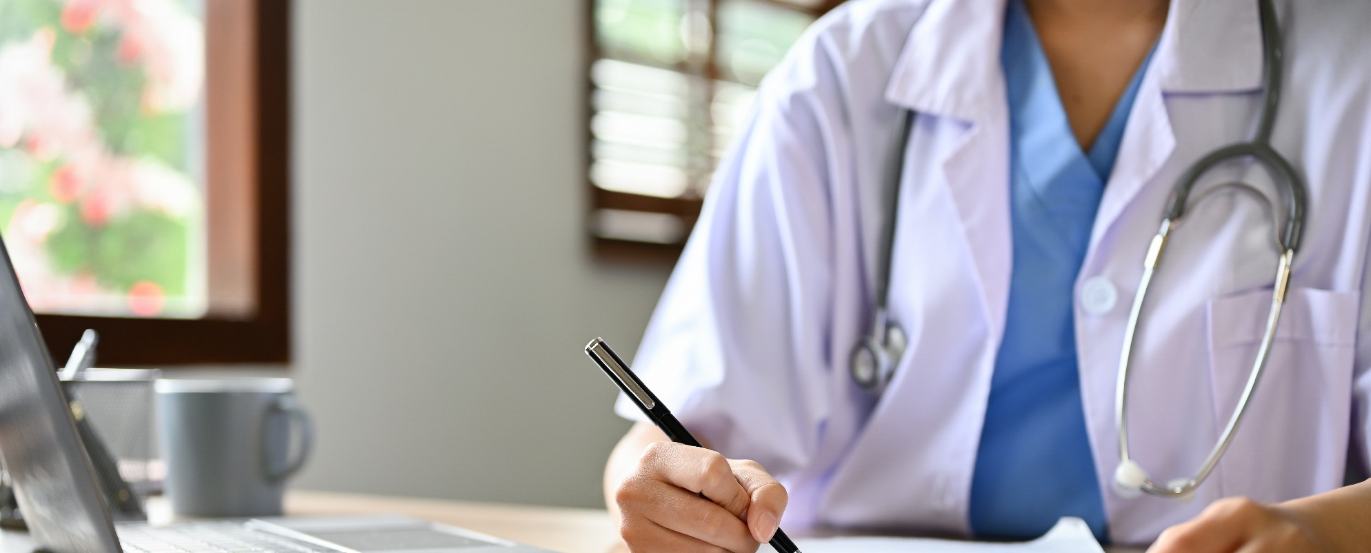 Doctor writing on Clipboard